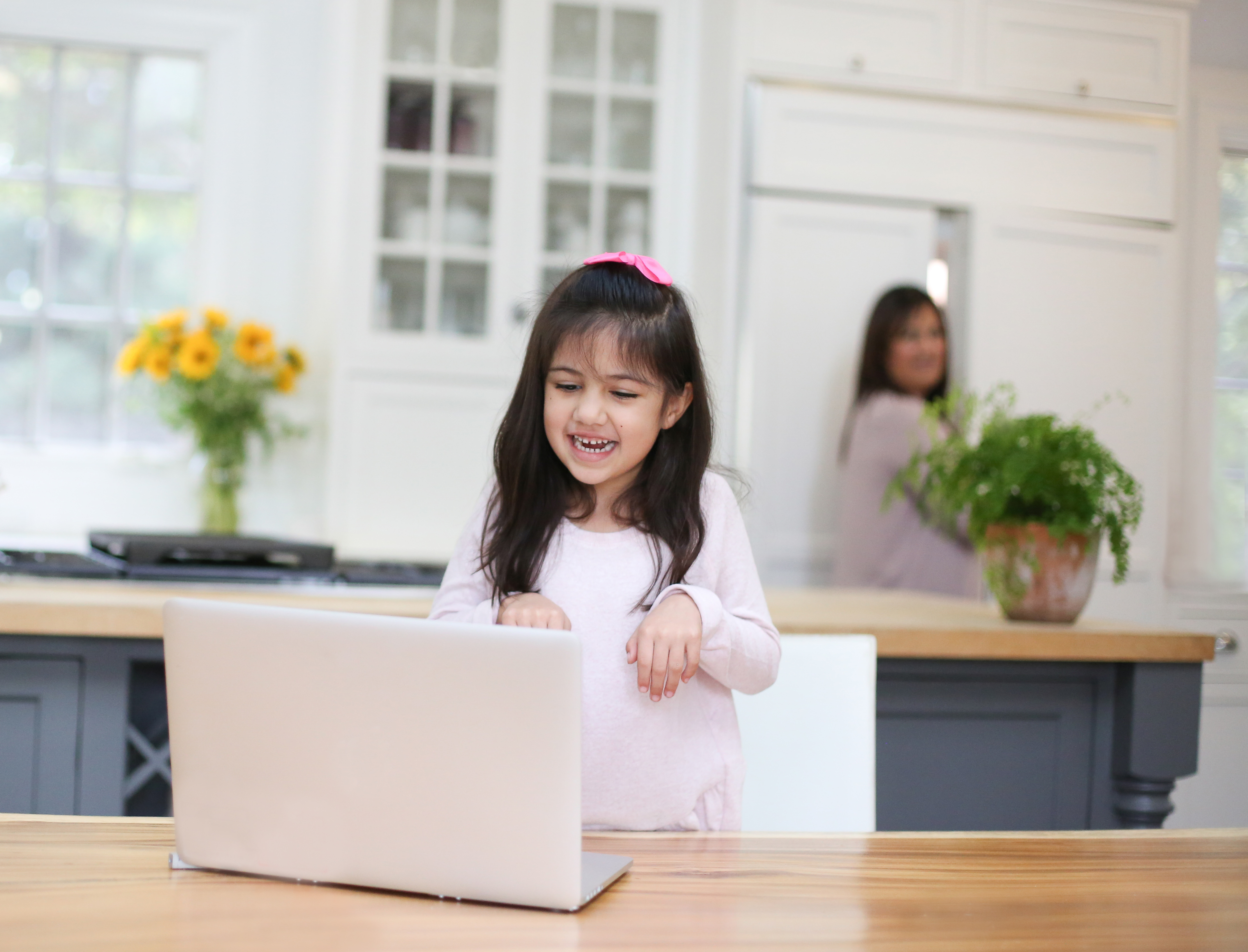 Image of a girl interacting with tutor in online foreign language lesson in Spanish.