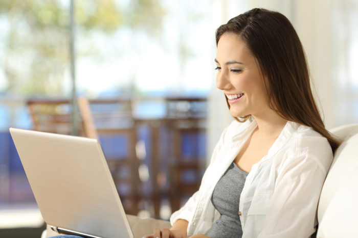 Image of a woman using her laptop. 