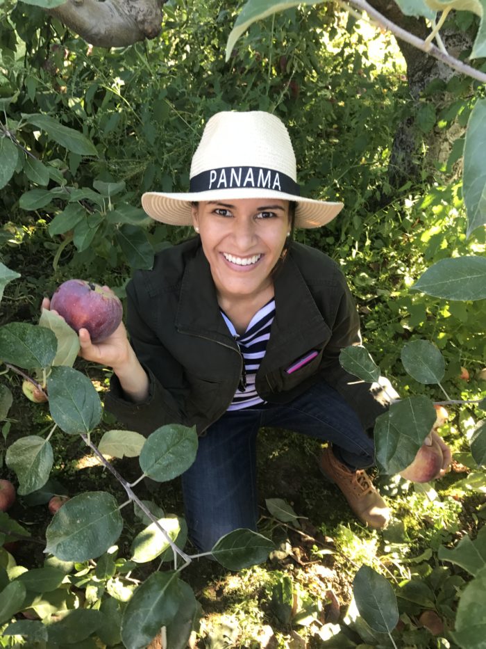 Photo of online Spanish tutor for kids in her garden.