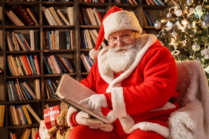 Picture of Santa Claus reading in his library