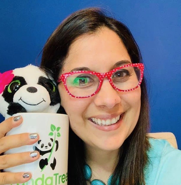 Spanish Tutor Ana poses with a panda